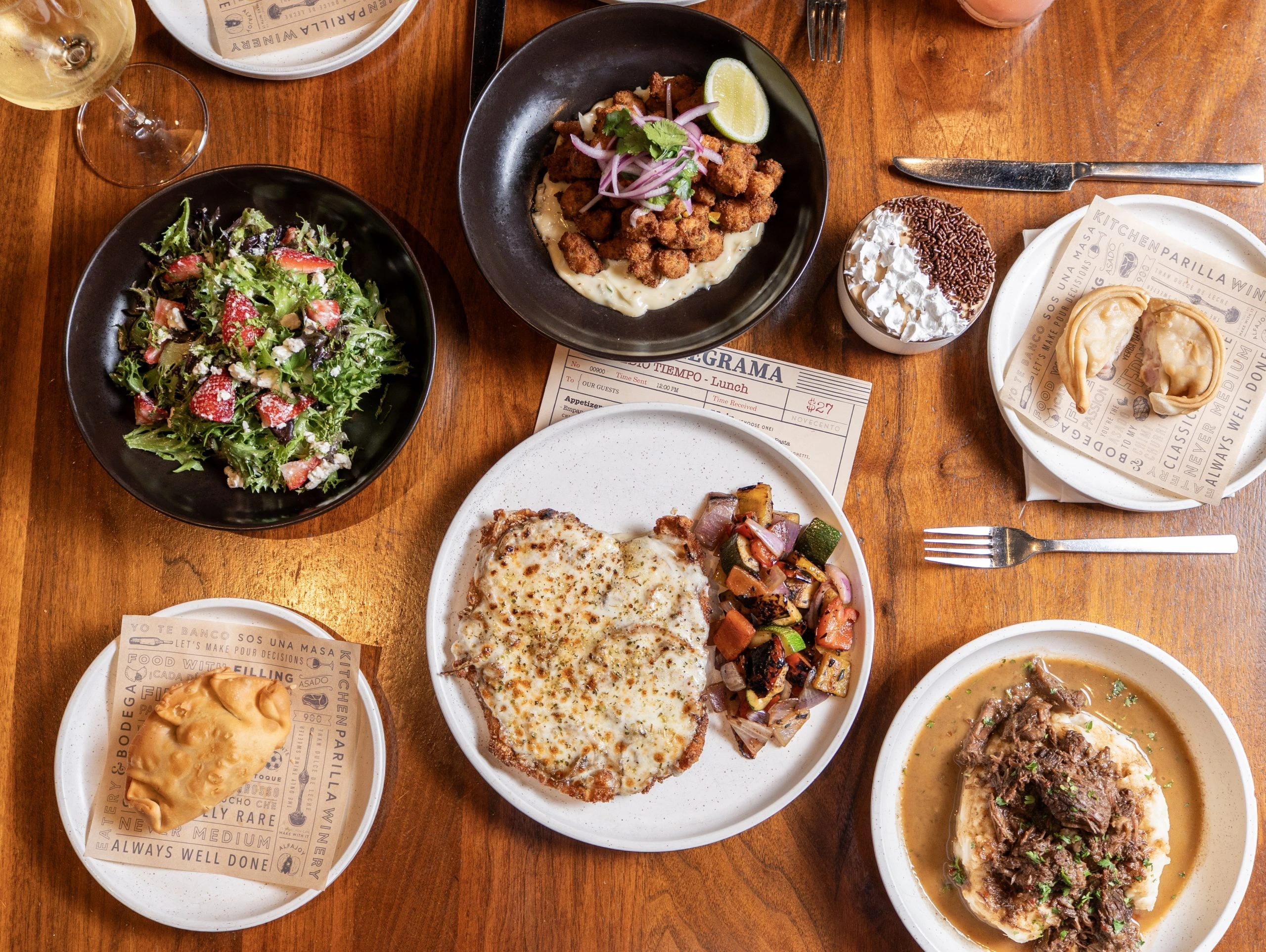 Novecento dishes including salad, empanadas and pasta